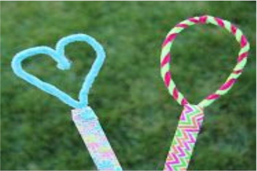Bubble wands made of straws and pipe cleaners into shapes; heart and circle