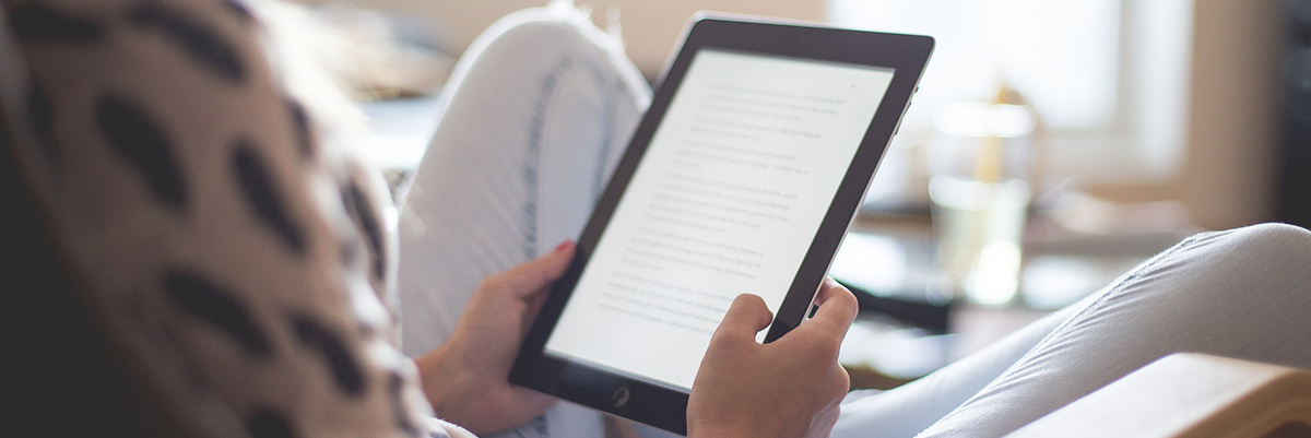 Woman reading ebook on kindle