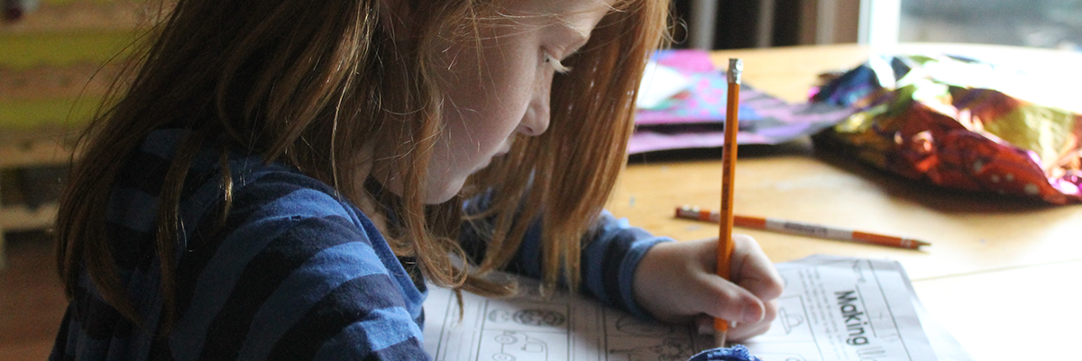 Young girl completing homework