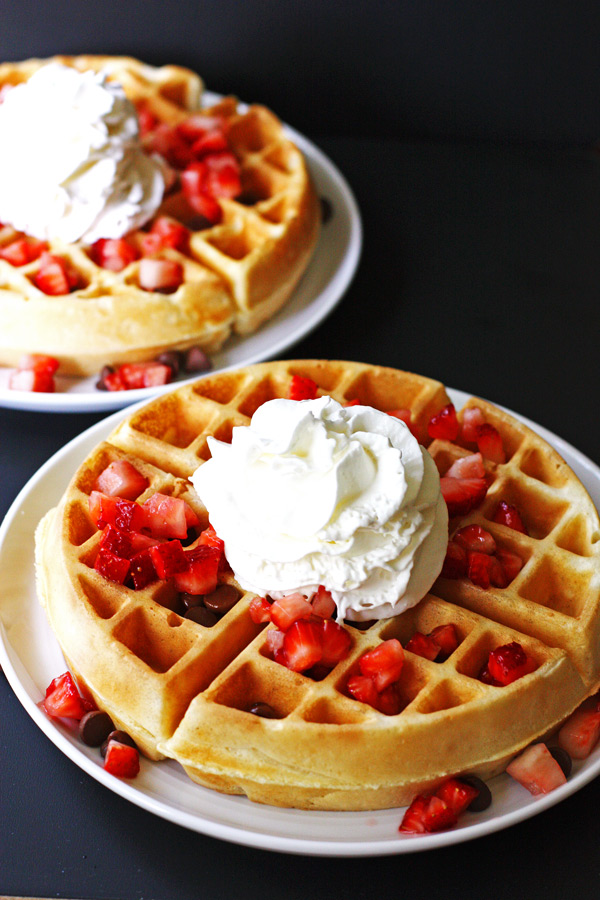 Belgian waffles with fruit and whipped cream