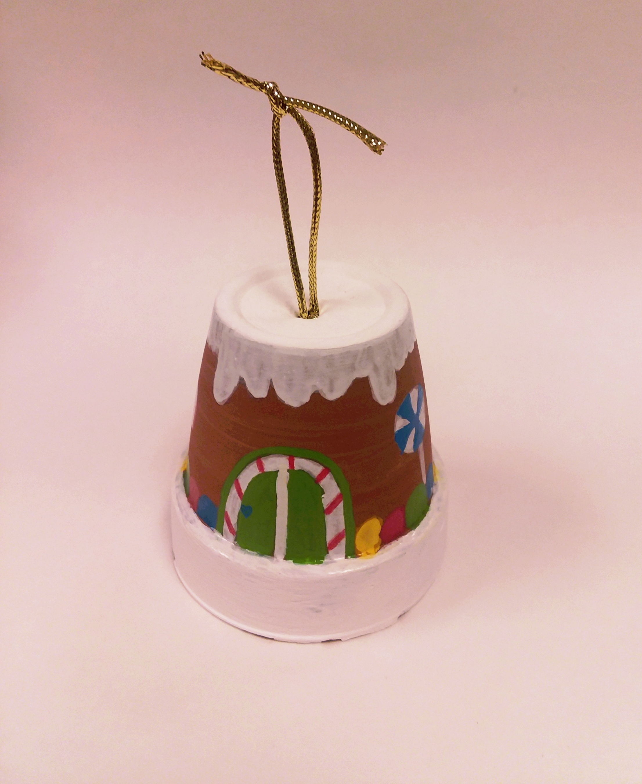 ornament made out of painted and decorated mini terra cotta planter