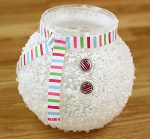 Glass vase covered by Epson salt and decorated with ribbon and buttons.