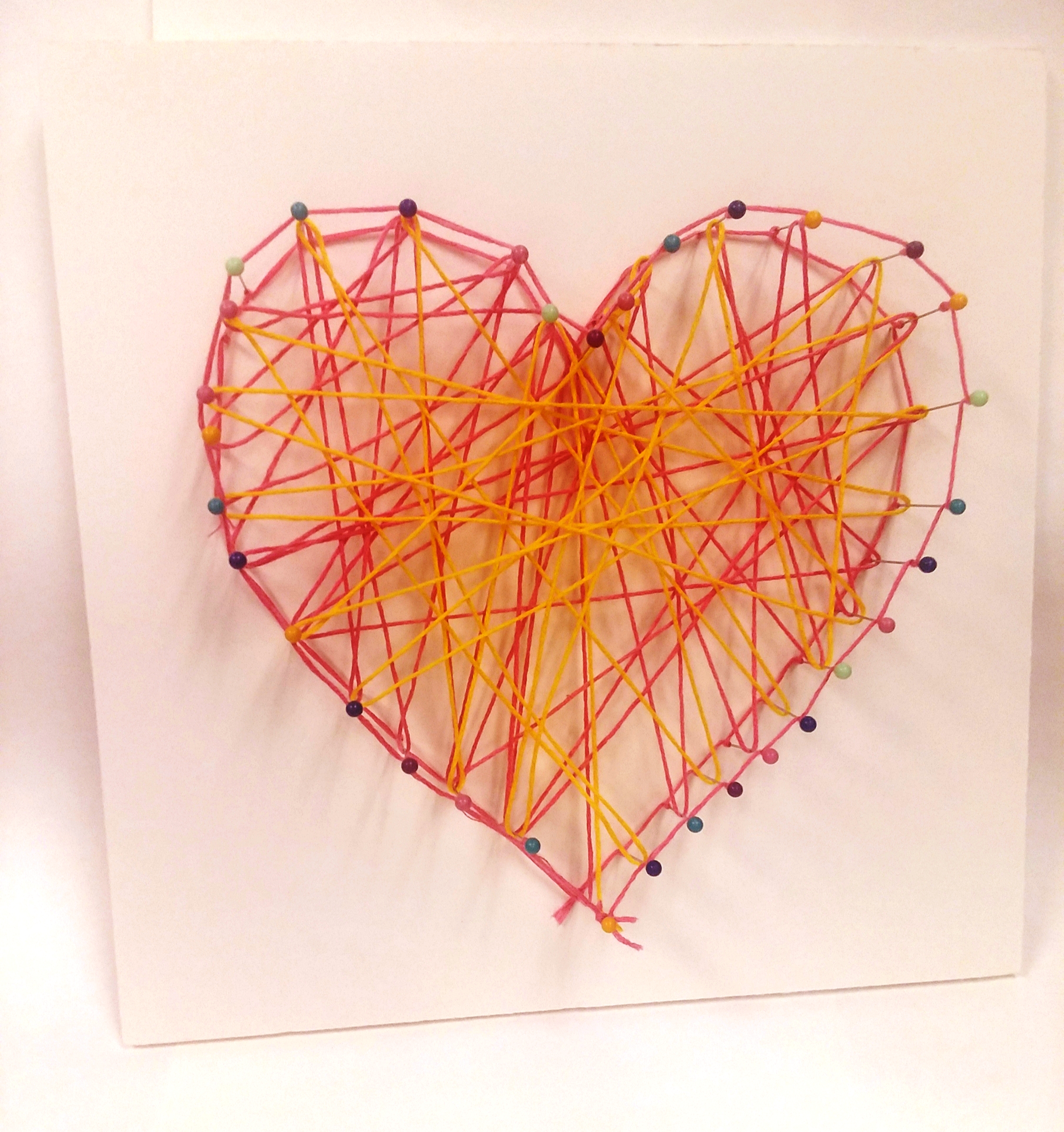 string art in the shape of a heart