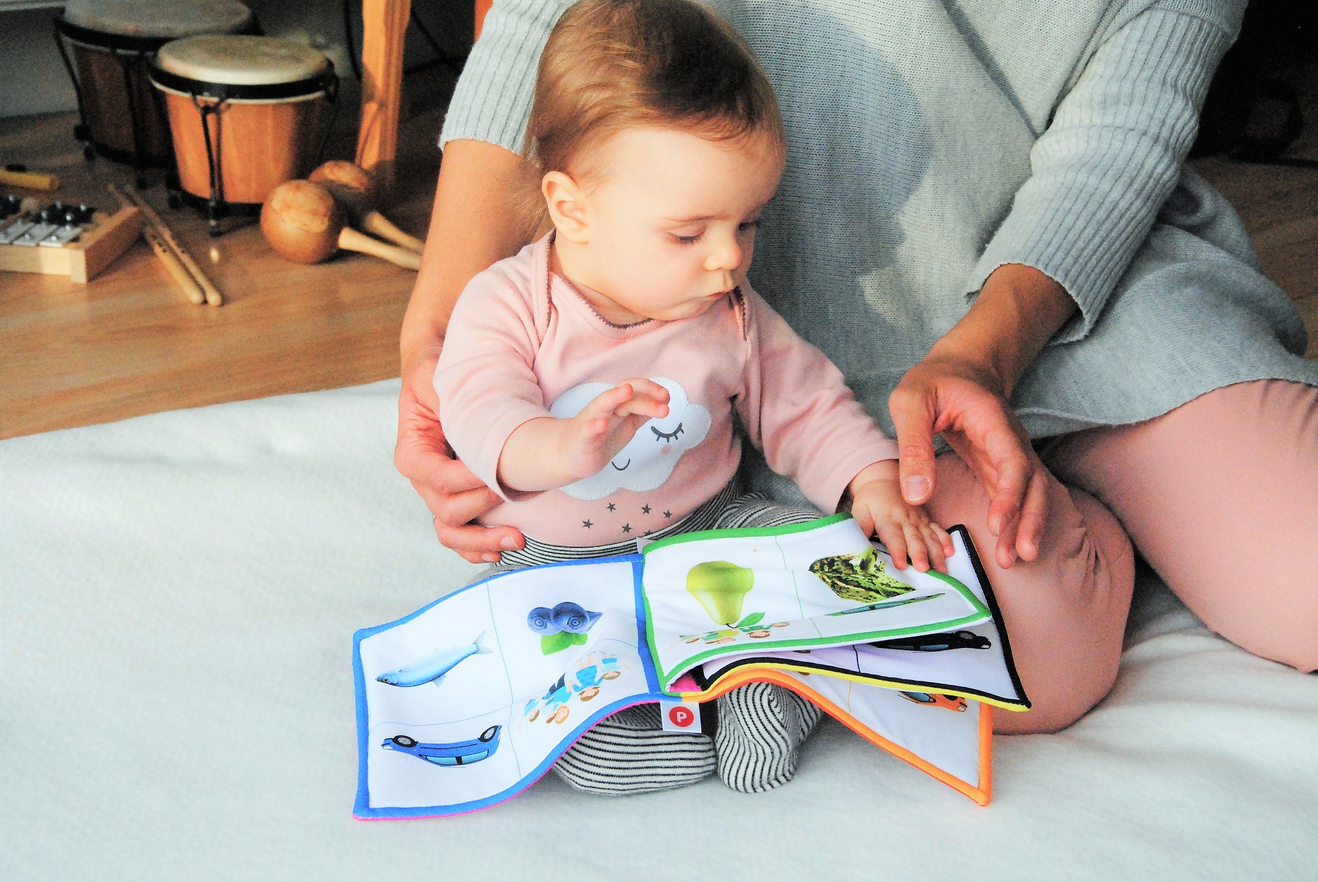 baby and adult reading