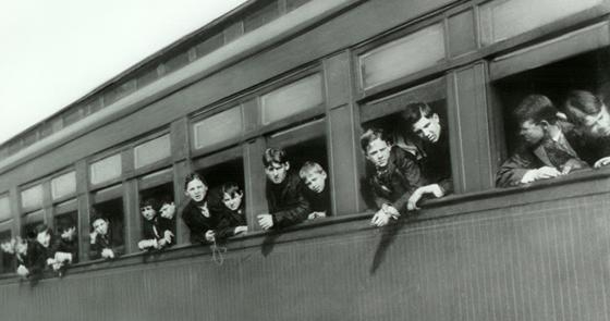 Boys looking out window of Orphan Train