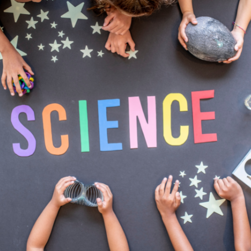 The word science with many hands and different science items in hands