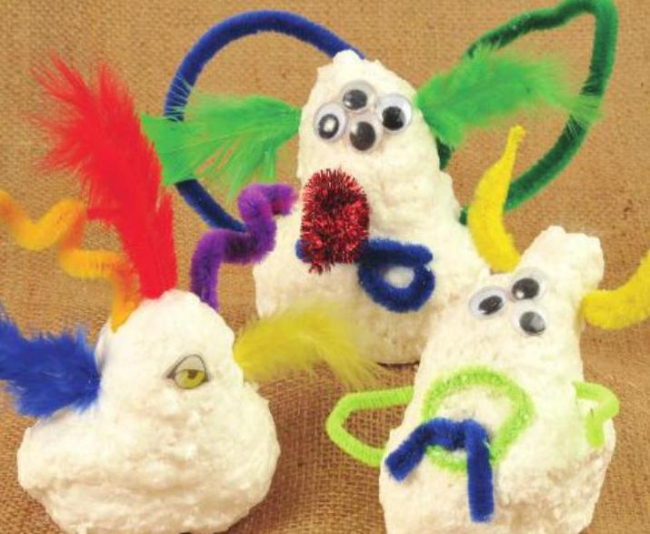 Ivory Soap shaped into monsters with goggle eyes, feathers, and pipe cleaners