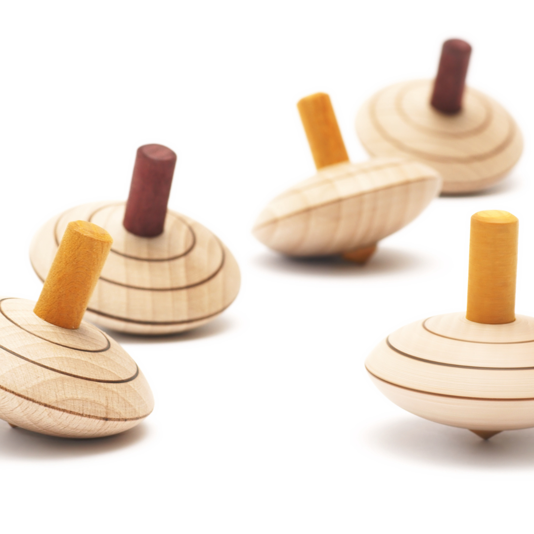 Five spinning wooden tops 