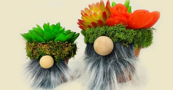 two bearded gnomes made of flowerpots, artificial moss and artificial flowers