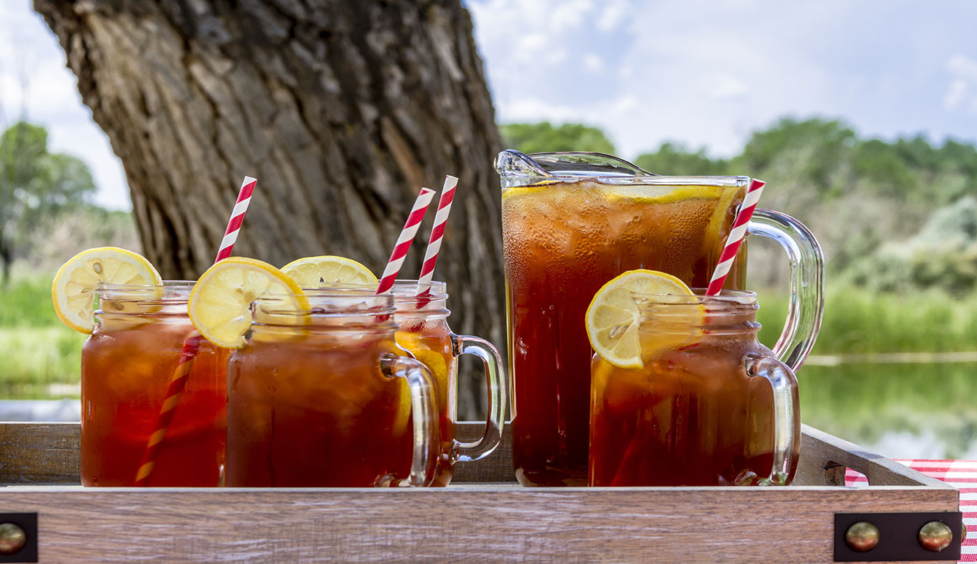 Pitcher and jars of iced tea