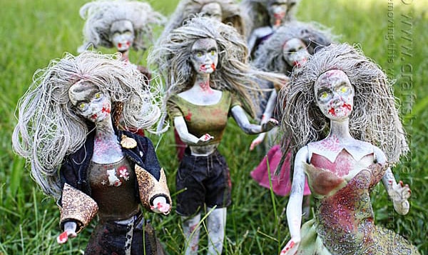image of a group of barbie dolls painted to look like zombies