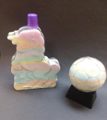 Unicorn and soccer ball bottles filled with colorful salt