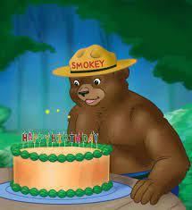 Smokey the Bear with birthday cake