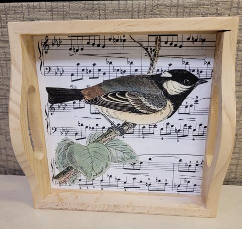Wooden tray with bird and music notes decoration inside