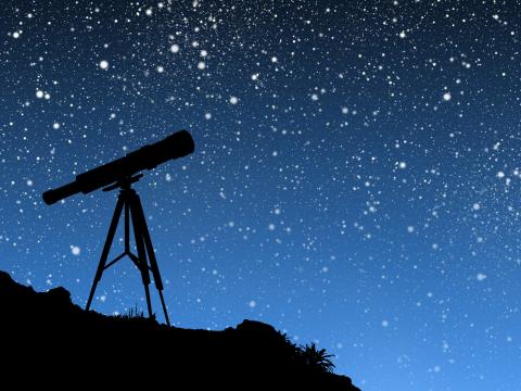 image of night sky and telescope 