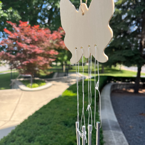 Butterfly wind chime with outdoor scenery