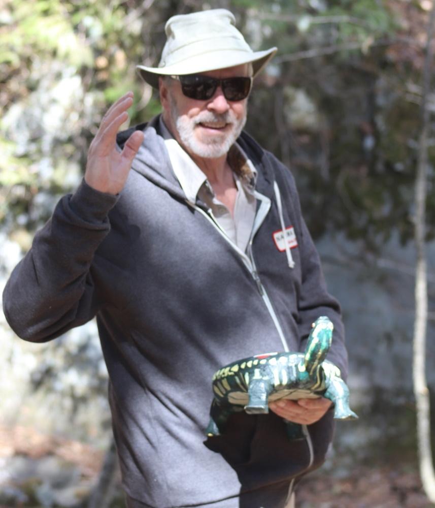 ron rademacher wearing a hat and waving while standing outdoors