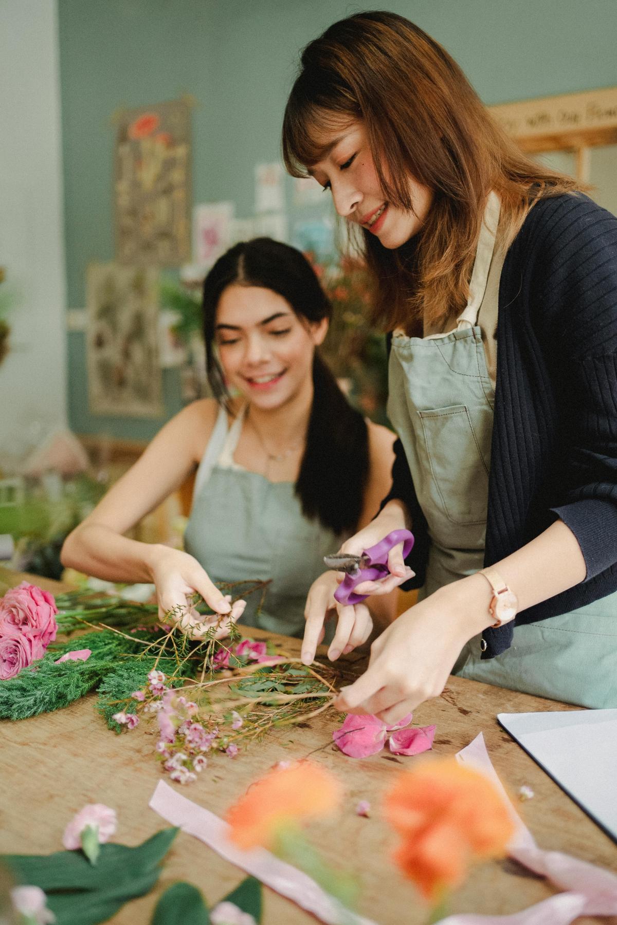Image of two women crafting with florals.